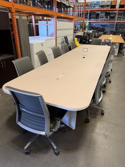 15’feet x 4’feet Glass top Conference table, seats 12 people.
