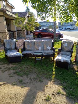 5 piece  outdoor patio furniture set with a 3 seater and 2 swivel rocking chairs
