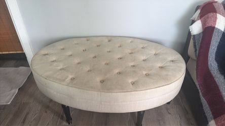 Oval Tufted Upholstered Ottoman with Casters