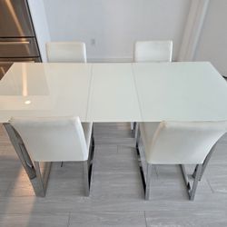 Dining Table Extendable Glass Top with 4 leather chairs Dining set. 