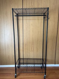 Black rolling garment rack (wire shelving with hanging bar)