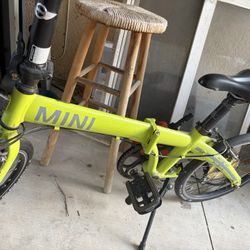 Mini cooper like green folding bike