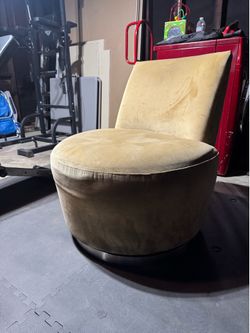 Tan swivel accent chair