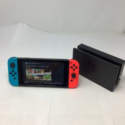 NINTENDO SWITCH WITH BASE AND CHARGER (used)