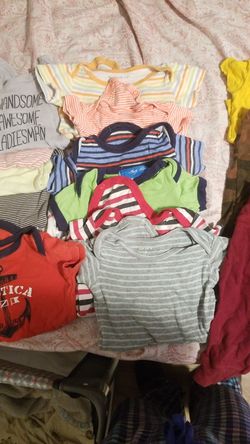 baby boy clothes of different sizes 1 dollar a piece shirts pants and rompers onesis 3 ... 6..9 .. months