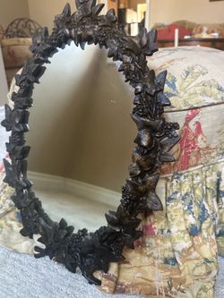 Antique decorative botanical themed oval mirror