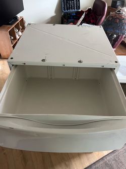 Metal laundry pedestal with a pull-out storage drawer