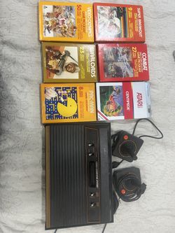 Atari with games and controller 