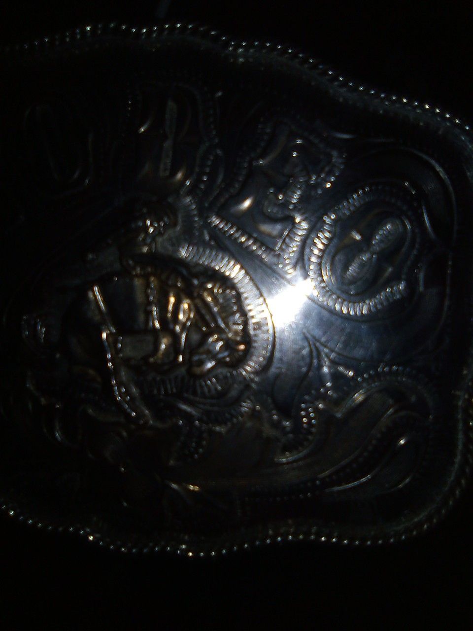 Silver rodeo belt buckle