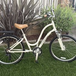 Electra townie 21d  step thru with rear rack and side basket that folds up, front fork suspension ,forward peddling and flat foot technology