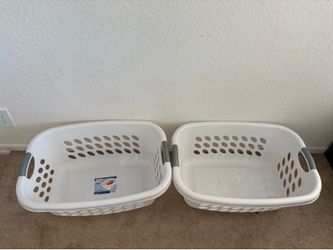 2 Sterilite Ultra HipHold laundry baskets featuring contoured sides for easy carrying