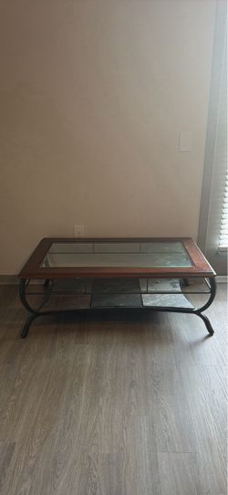 Brown coffee table with glass top