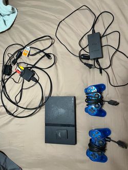 PS2 Slim with cords and controllers