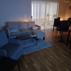 Chair With Ottoman Couch With Chaise Two End Tables And Coffee Table.