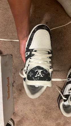 Black and white LV Trainers