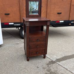 Antique furniture piece with drawers and swivel mirror