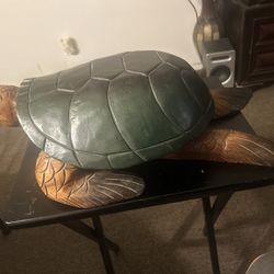 hand-carved wooden sea turtle sculpture, commonly referred to as a Hawaiian
