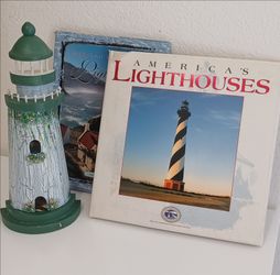 Light houses books and a wooden light house