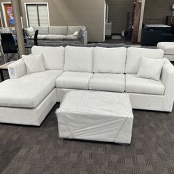 New White Cream Sectional And Ottoman 