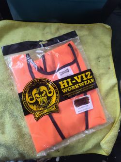 Bright orange high visibility safety vest