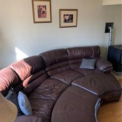 Leather Sectional With Two Ottoman.