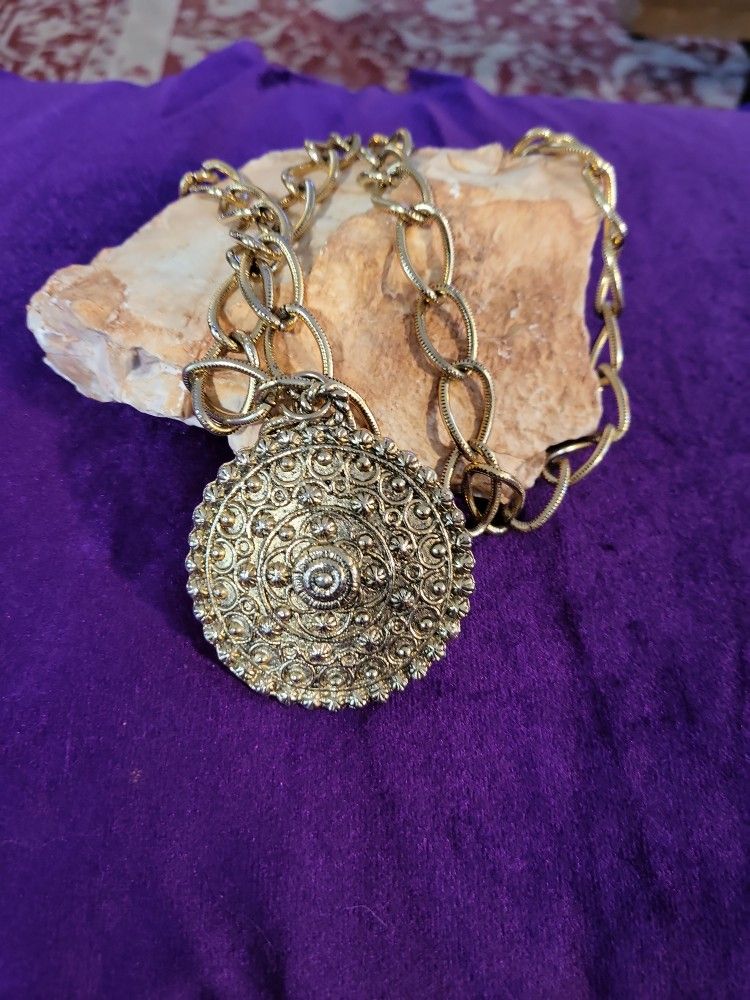 Goldtone Medallion. Goldtone Chain.