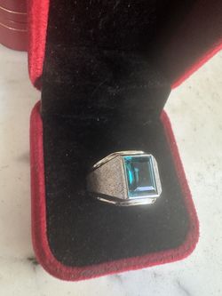 Beautiful 925 Sterling silver ring w/ blue emerald cut Cz stone , size 8, marked Sterling w/a symbol