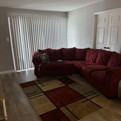 Red more of a brick red sectional & Rug 