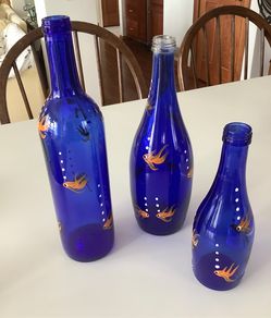 Blue glass bottles with hand painted fish
