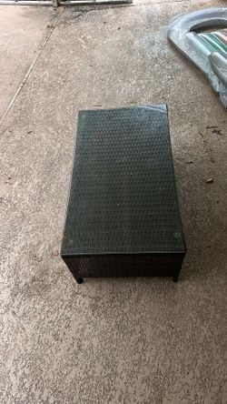 Wicker patio table with glass top