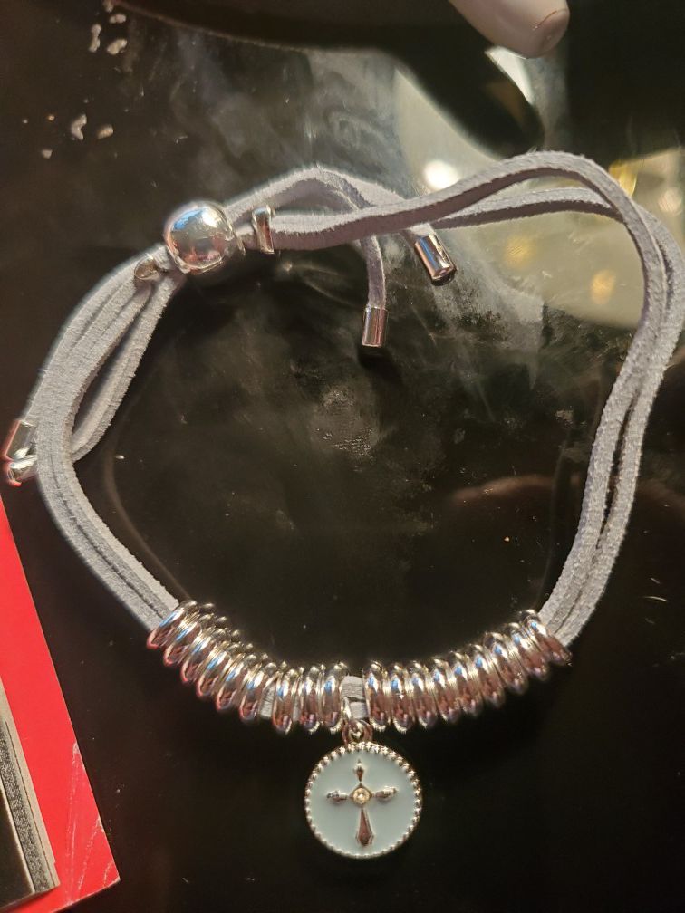 Symbolic charm cord bracelet
