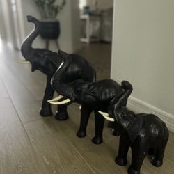 set of handmade leather elephant figures