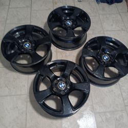 4 Black 17inch BMW Rims And 1,  17inch Tire In Really Good Shape