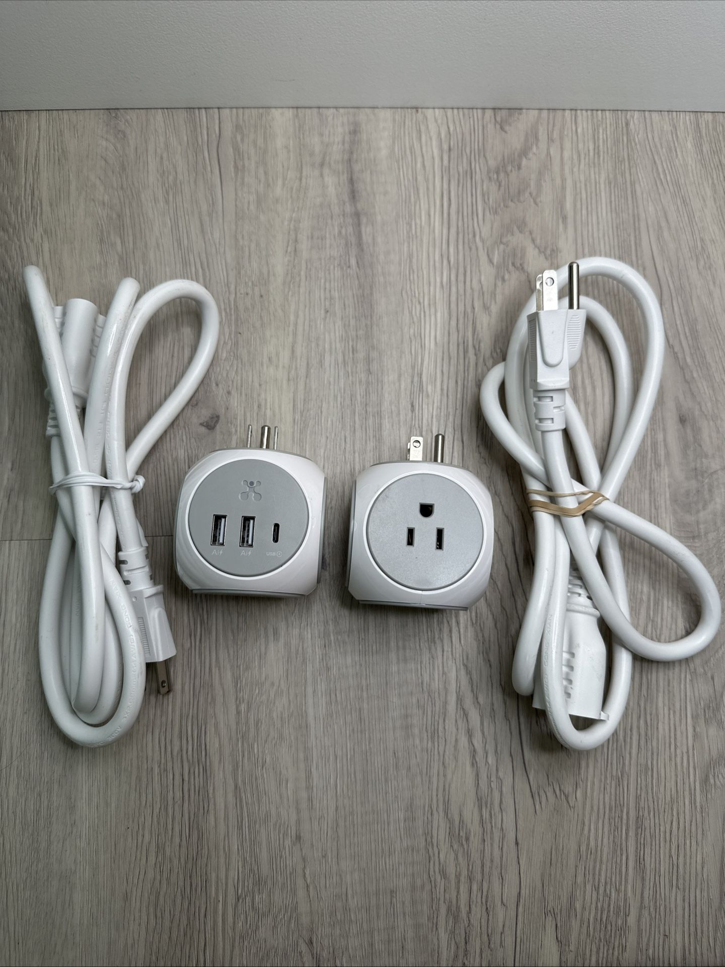 Atomi Power Cube 2 Pack. Each with 3 AC Outlets, 12w-port, 2 USB Ports.