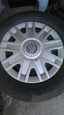 4 rines con llantas y tapaderas medida 16" para Mercury grand marquis