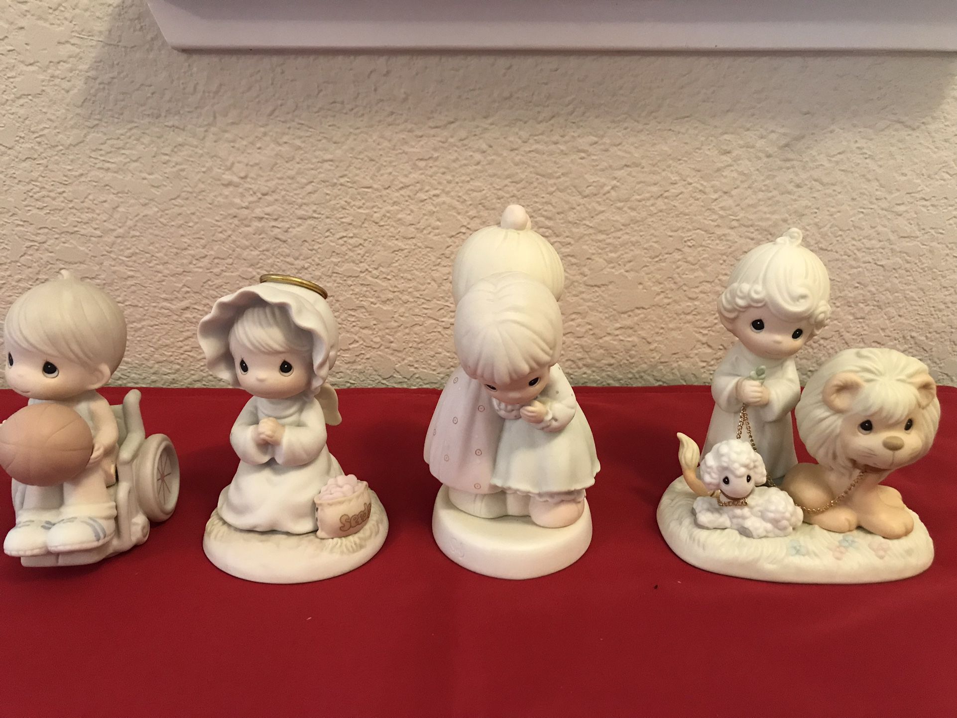 A group of 4 vintage Precious Moments figurines