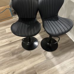 Modern Black Swivel Bar Stools (Set of 2) – Adjustable Height, Faux Leather” “Contemporary Tulip Base Bar Chairs – Black, Swivel & Adjustable (Pair)” 