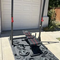 Very nice weight bench and squat rack. $300
Olympic weight plates sold separately. 

Lots Of Olympic Weights Available. 45s, 35s, 25s, 10s, 5s. 