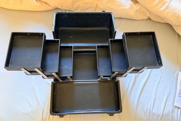 Expandable black makeup organizer case with multiple compartments.