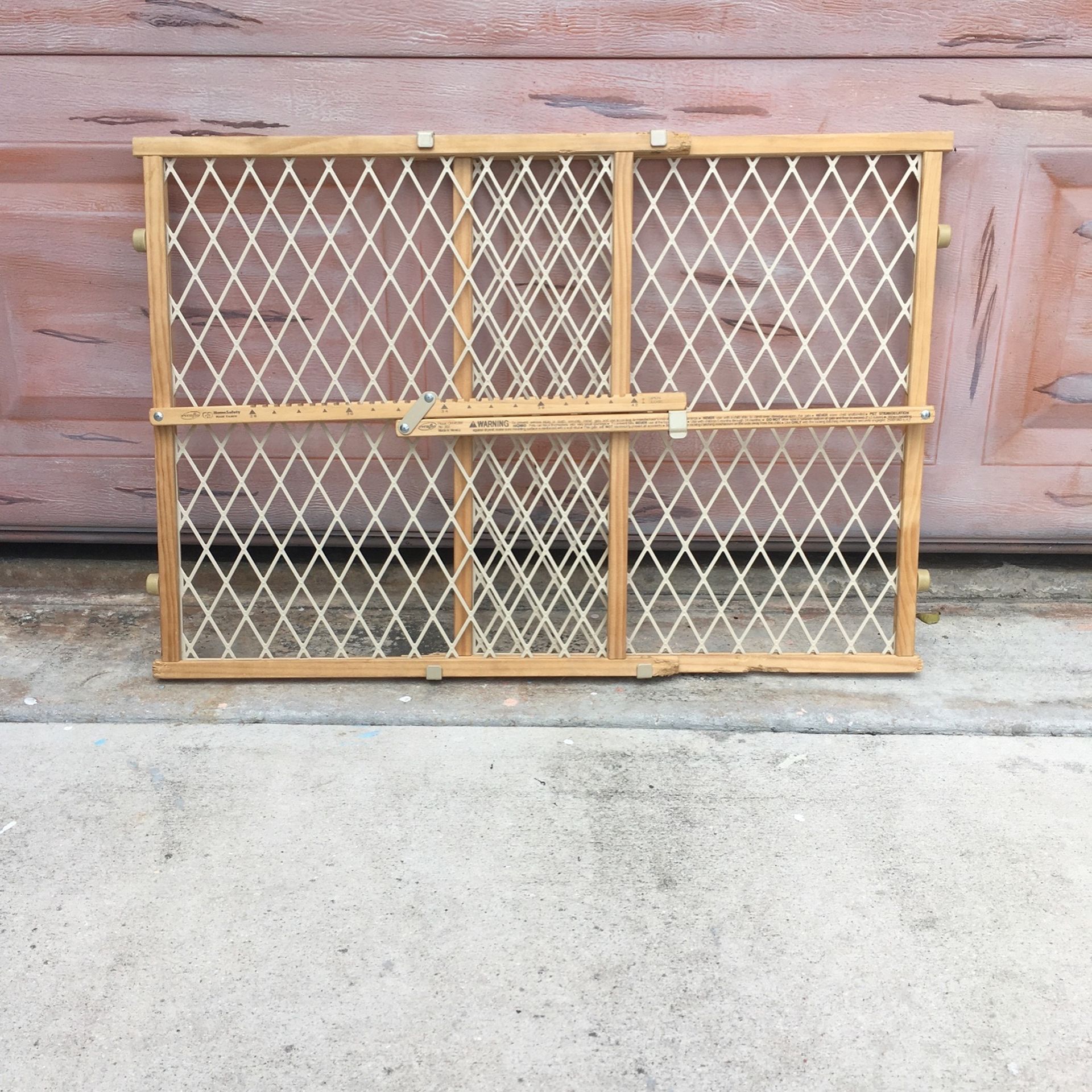 Child or pet protection gate. Shows some wear