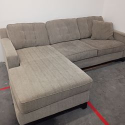 Small brown sectional couch