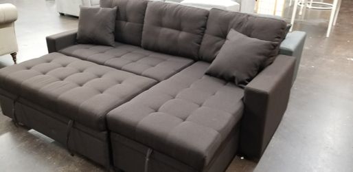 Chocolate sofa chaise sectional with a pullout bed