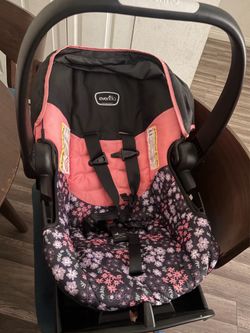 $60 Even Flo car seat pink with its base.