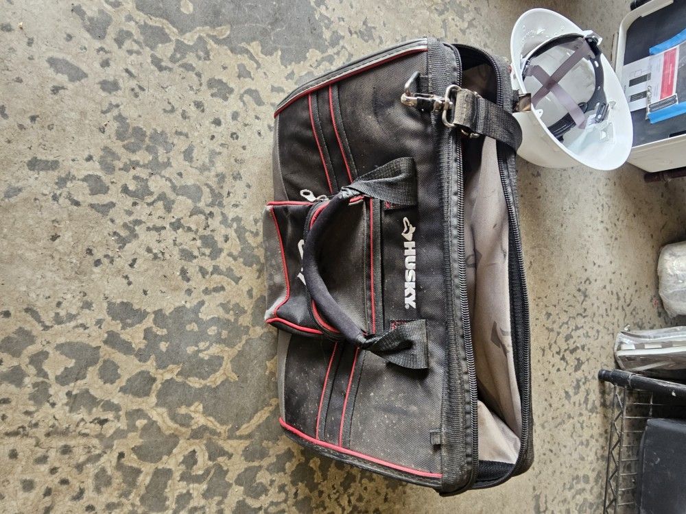 Husky 16-inch Large Mouth Tool Bag with Parts Bin Zone.