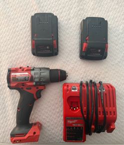 Milwaukee M18 Fuel Hammer Drill with 2 high output 3.0 batteries and charger.