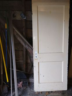 Antique hardwood two panel interior door slabs times three with large amount of original hardware