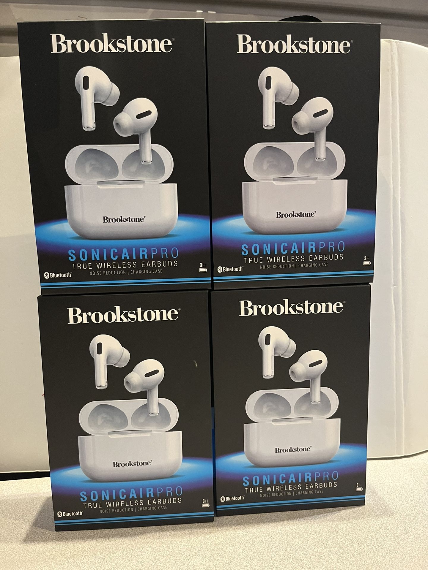New lot of 4 Brookstone Sonic Air Pro True wireless air buds, noise reduction with Charging Case