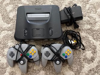 Nintendo 64 console with two controllers