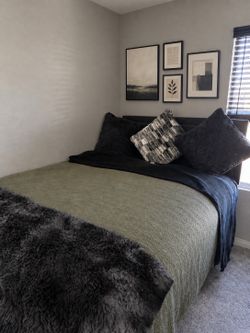 Full size bed with bed frame and mattress topper
