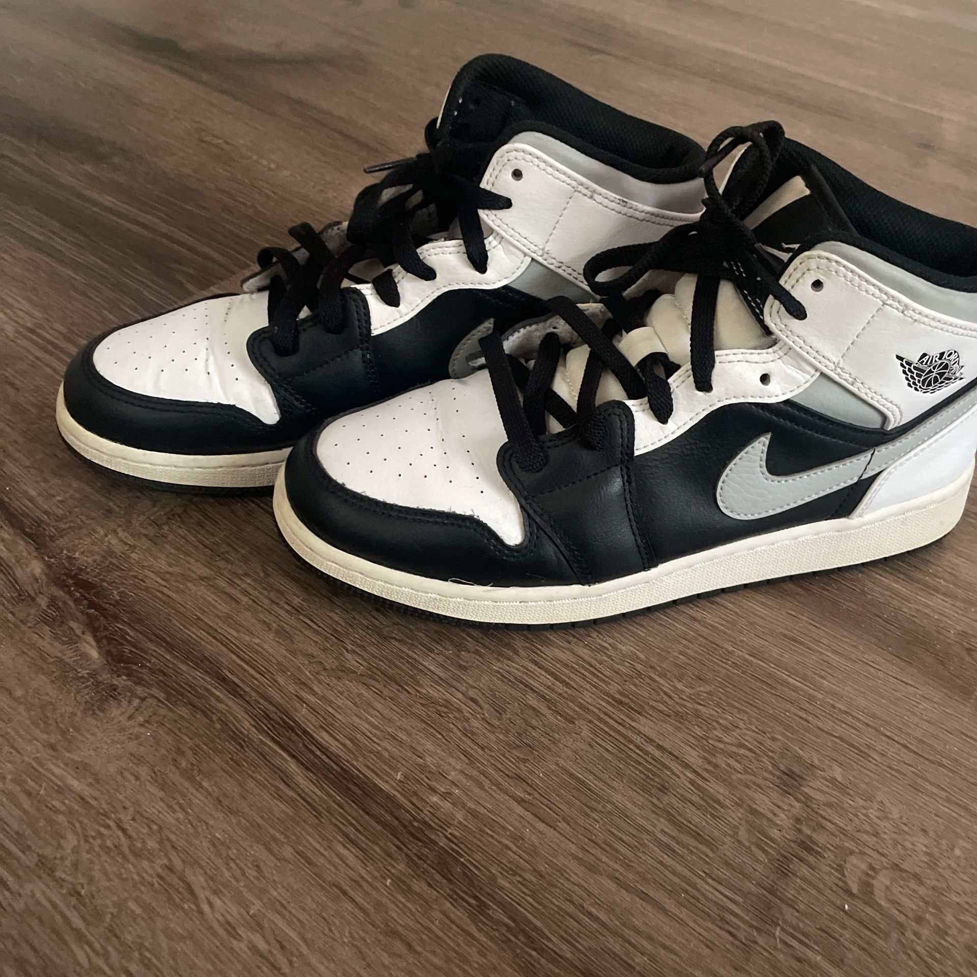 Black , White And Grey Jordan 1s